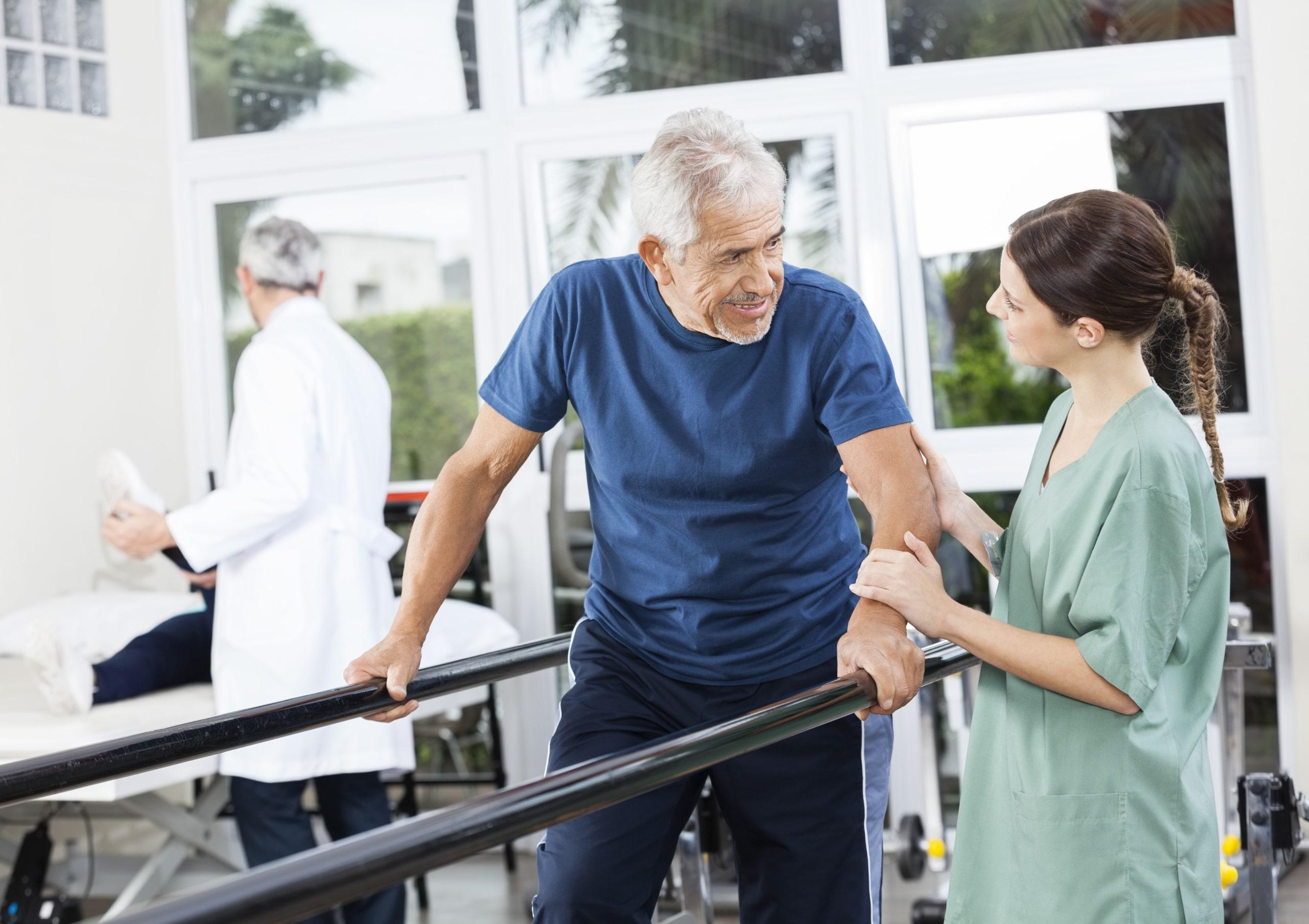 Elderly patient doing gait training exercises in physical therapy